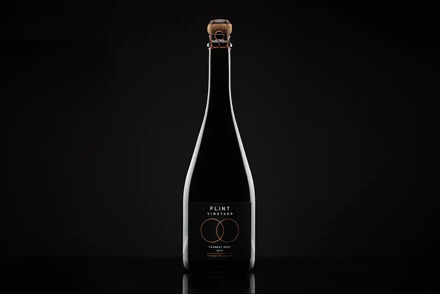 Flint Vineyard Charmat sparkling wine bottle on a black background