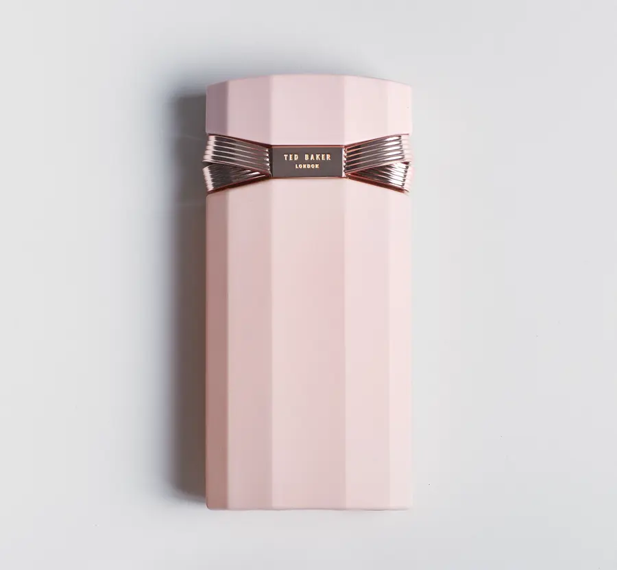 Ted Baker Est. ’88 fragrance bottle in pink with a rose-gold bow cap